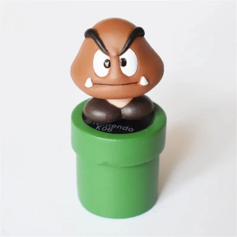 Goomba sobre una tubería verde